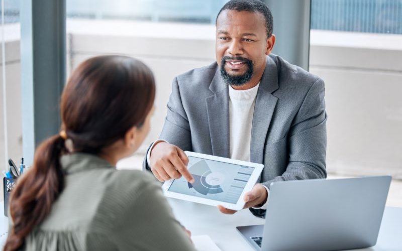 Man offering financial advice to business owner