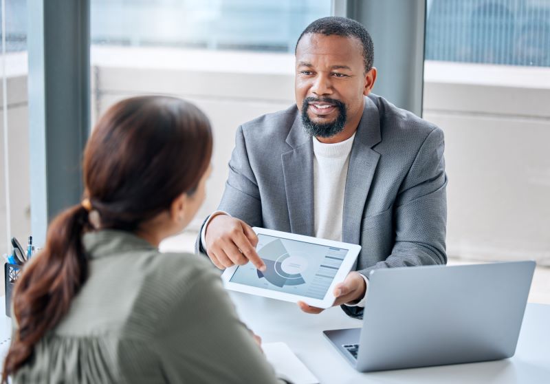 Man offering financial advice to business owner