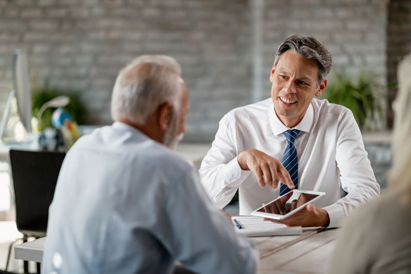 advisor advising older client