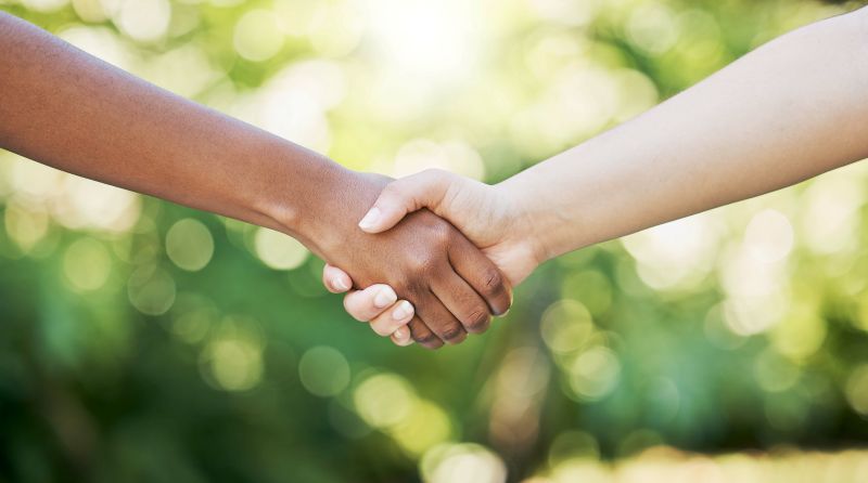 cropped picture of hands shaking signifying partnership